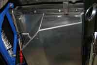 Driver side bottom of the fuel cell.  Not much room for the exhaust pipe here.